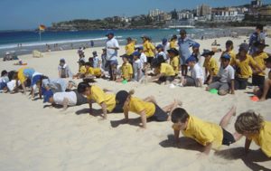 Primary children having races on beach