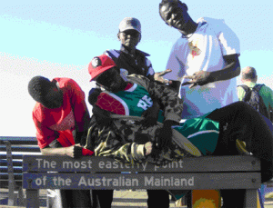 Students from Evans Intensive English Centre by sign - The most easterly point of the Australian Mainland