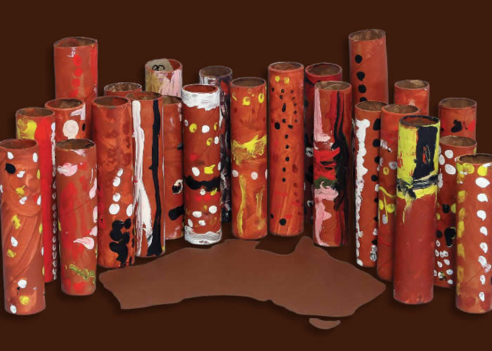 Cardboard rolls painted as totem poles