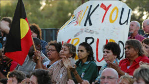 people marching with sign - Thank you Kevin Rudd