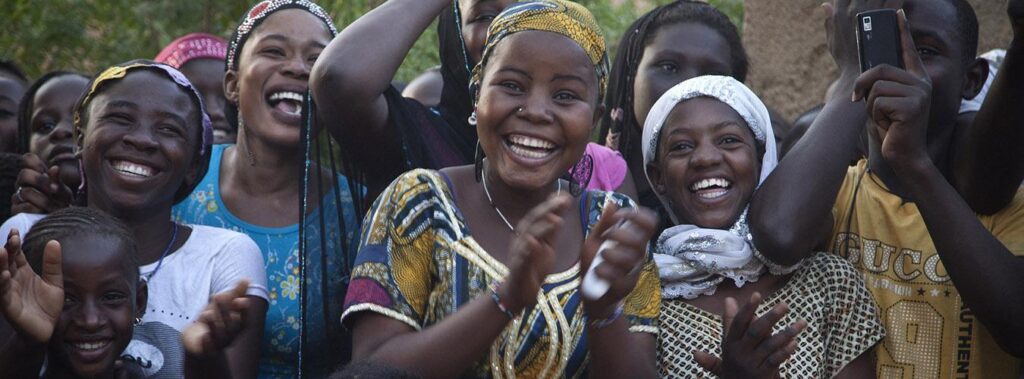 Smiling, laughing women at a Peace performance