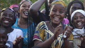 Smiling, laughing women at a Peace performance