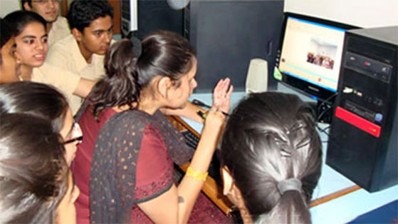 Senior students working on a computer